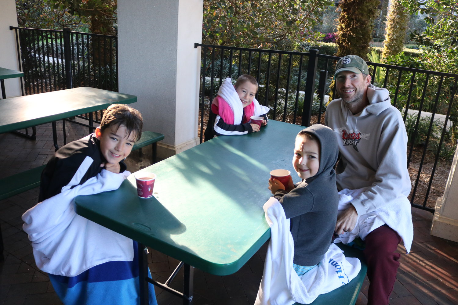 Walker, Cooper, Archer and Don Williams look to warm up with hot chocolate after the plunge.